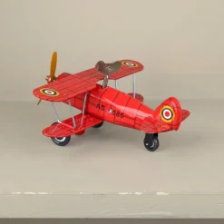Avion biplan rouge mécanique