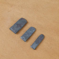 Coin forgé pour manche d'outil