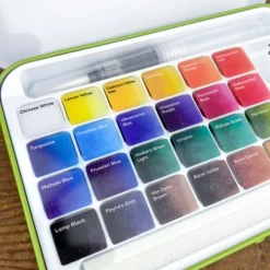 La boîte aquarelle et pinceau réservoir d'eau