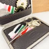 Petit set de couture de voyage en cuir